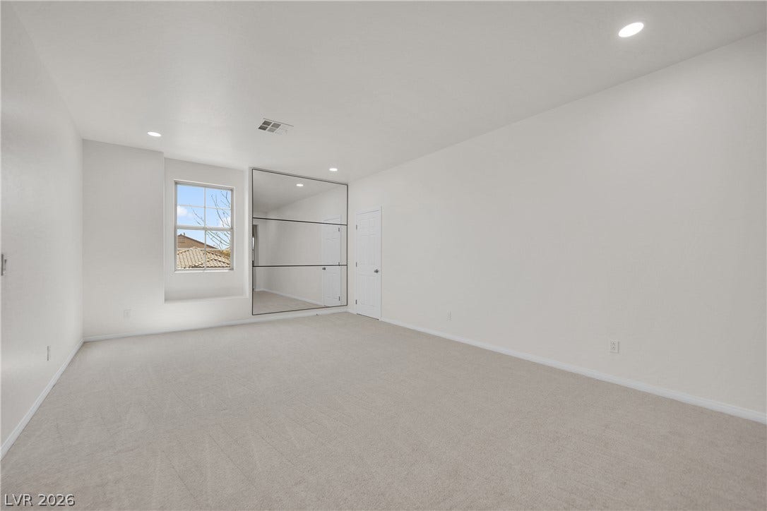 771 White Dogwood Court, Las Vegas, NV 89148 Recessed lighting and a mirrored wall amplify the open, naturally illuminated space.