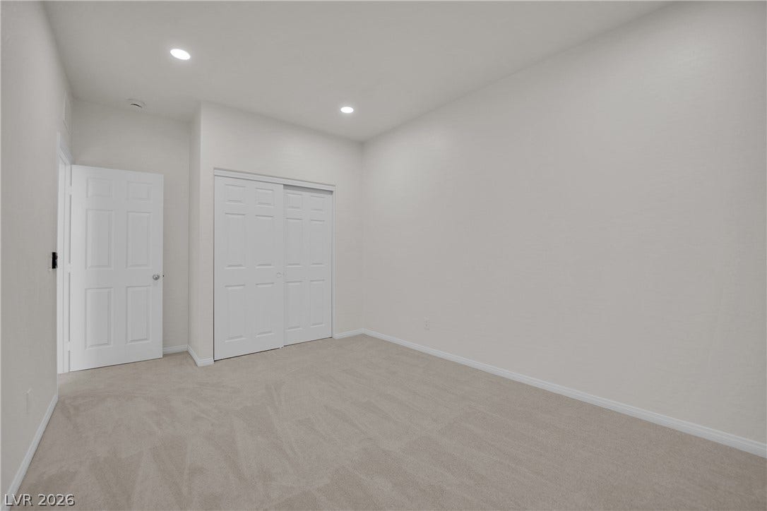 771 White Dogwood Court, Las Vegas, NV 89148 Clean lines and a neutral palette await personalization in this cozy bedroom.