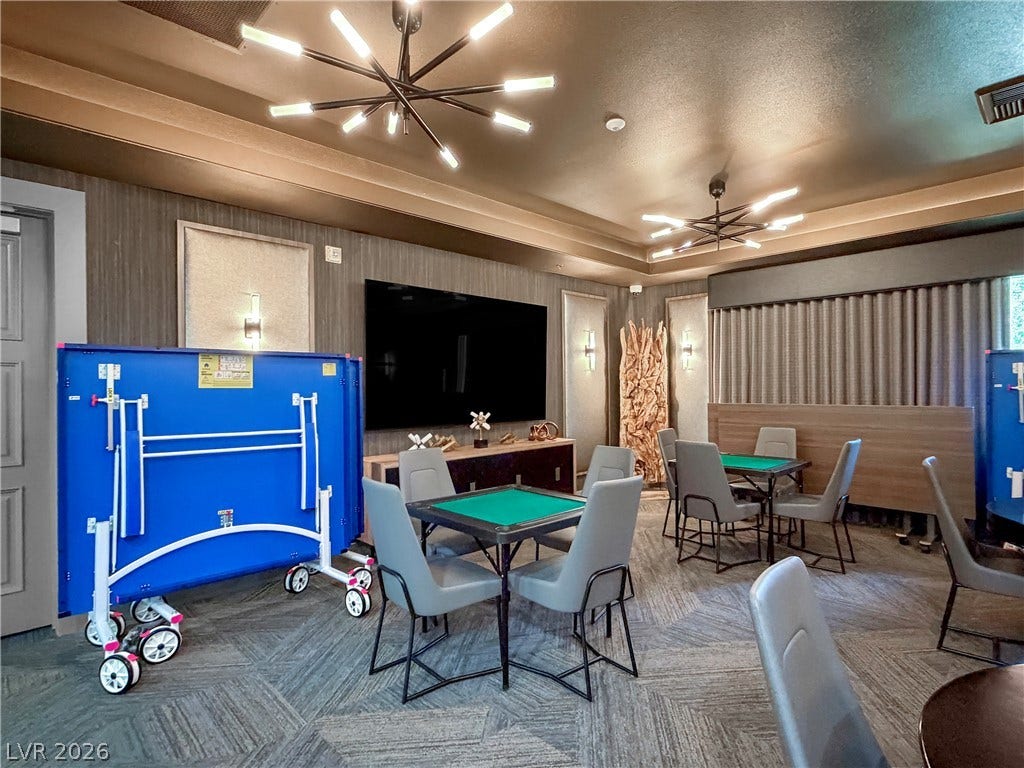 771 White Dogwood Court, Las Vegas, NV 89148 An inviting recreation room with contemporary lighting and versatile game tables offers entertainment.
