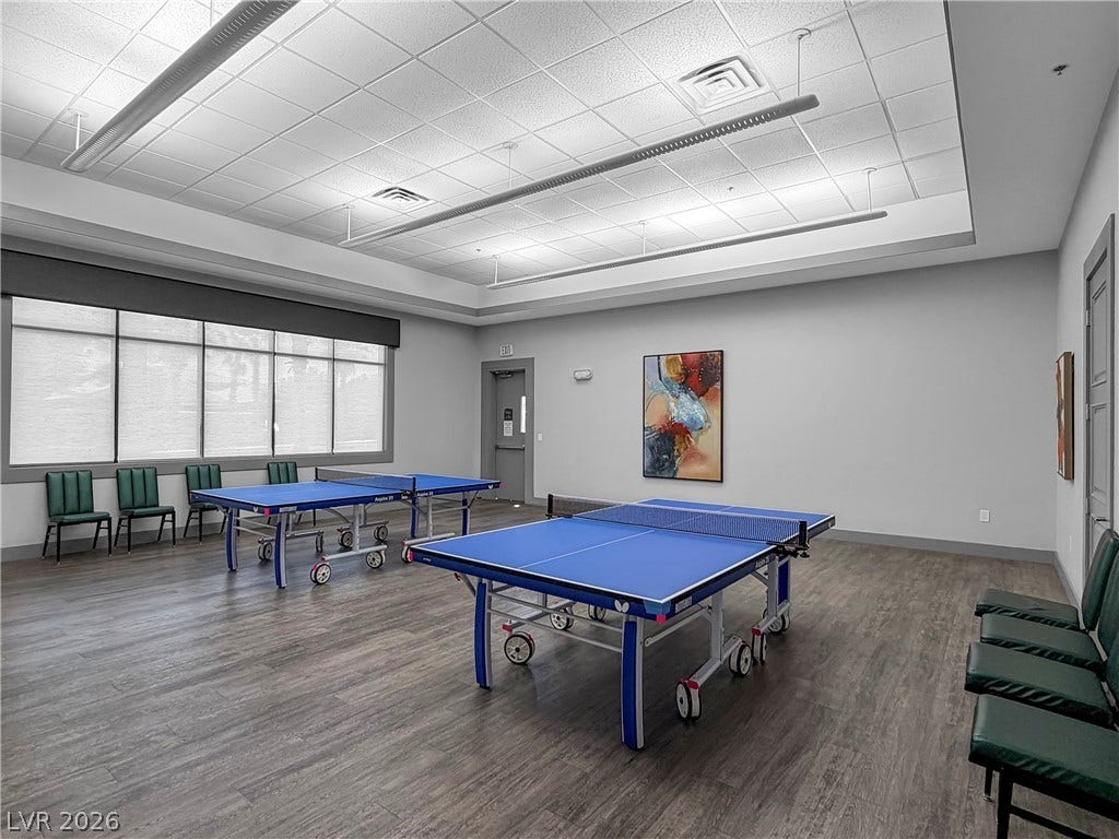 771 White Dogwood Court, Las Vegas, NV 89148 Two ping pong tables sit ready for play in this naturally illuminated recreation room, perfect for active enjoyment.