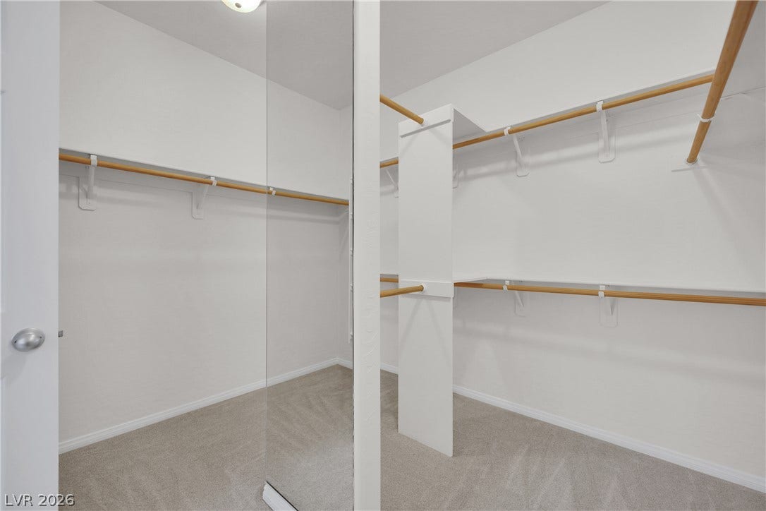 771 White Dogwood Court, Las Vegas, NV 89148 Ample hanging space and shelving offer exceptional organization within this well-appointed closet.