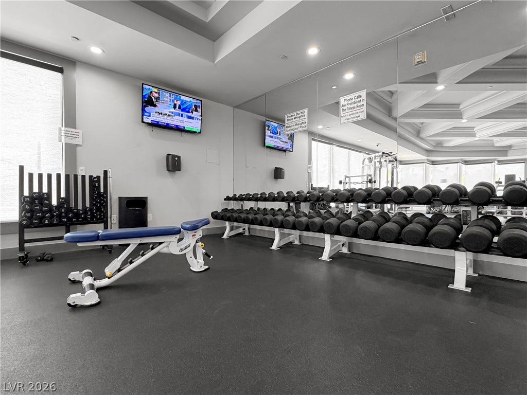 771 White Dogwood Court, Las Vegas, NV 89148 Fitness enthusiasts will appreciate this well-appointed gym, featuring extensive free weights and exercise equipment.