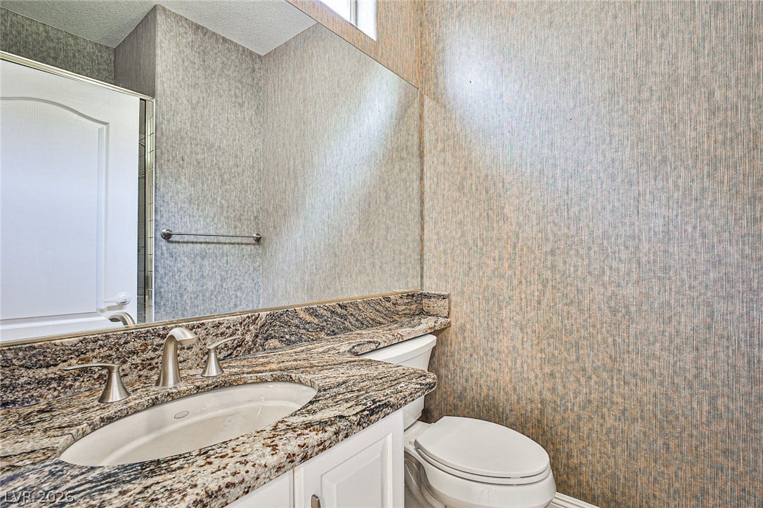 1828 Dolce Drive, Las Vegas, NV 89134 Granite counters and a vessel sink enhance this compact, efficient bathroom.