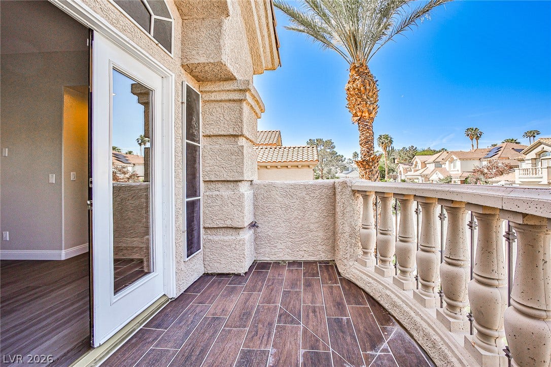 1828 Dolce Drive, Las Vegas, NV 89134 An inviting balcony, perfect for sun-drenched mornings, extends a comfortable outdoor living space.