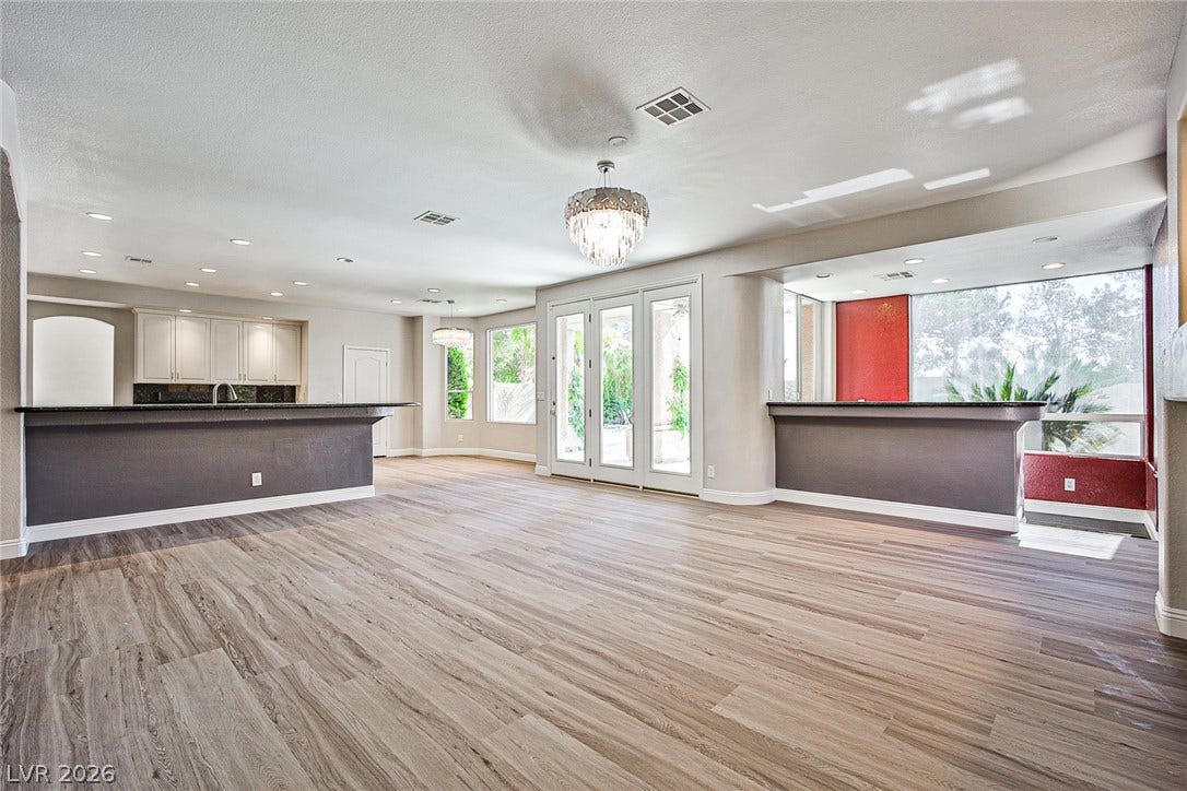 1828 Dolce Drive, Las Vegas, NV 89134 An open-concept living space with lustrous wood flooring and abundant natural light.