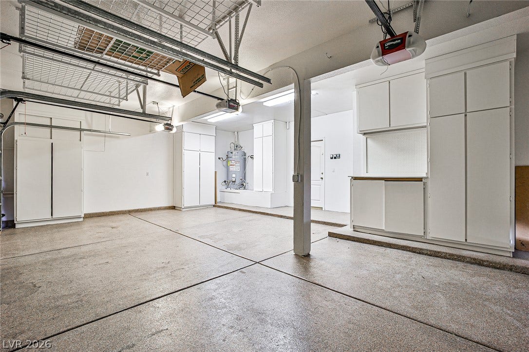 1828 Dolce Drive, Las Vegas, NV 89134 Functional garage with ample built-in storage solutions and overhead shelving.