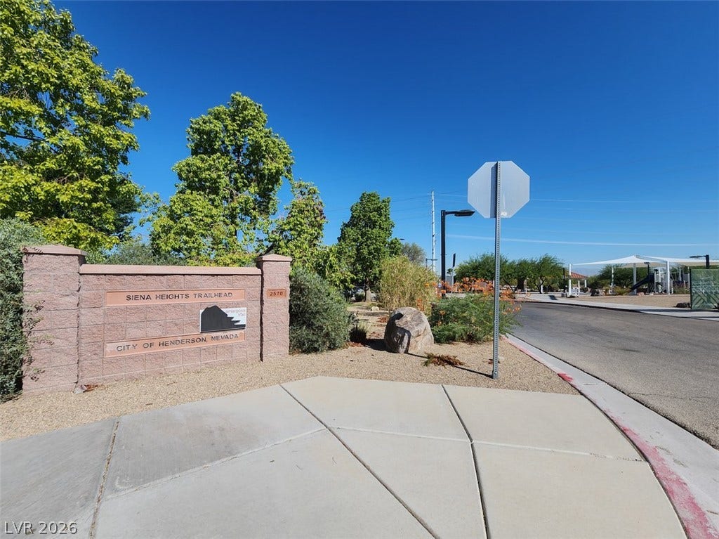 505 Rafkin Place, Henderson, NV 89052 A welcoming trailhead entrance beckons with mature trees and a clear blue sky overhead.