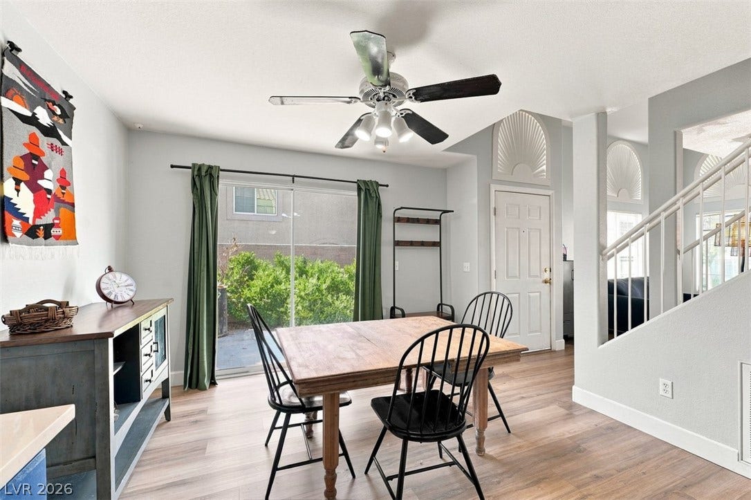 505 Rafkin Place, Henderson, NV 89052 Wood style flooring enhance this inviting dining area, with a glass slider opening to outdoor greenery.