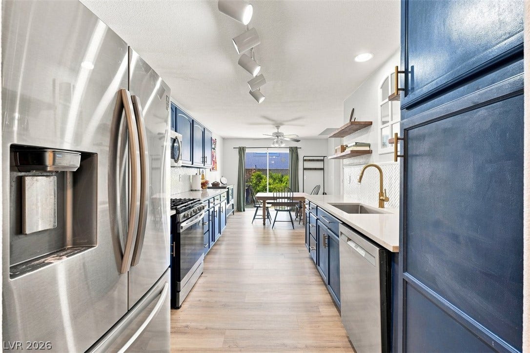 505 Rafkin Place, Henderson, NV 89052 A well-appointed kitchen features stainless steel appliances, ample cabinetry, and a bright, open flow to the dining area.