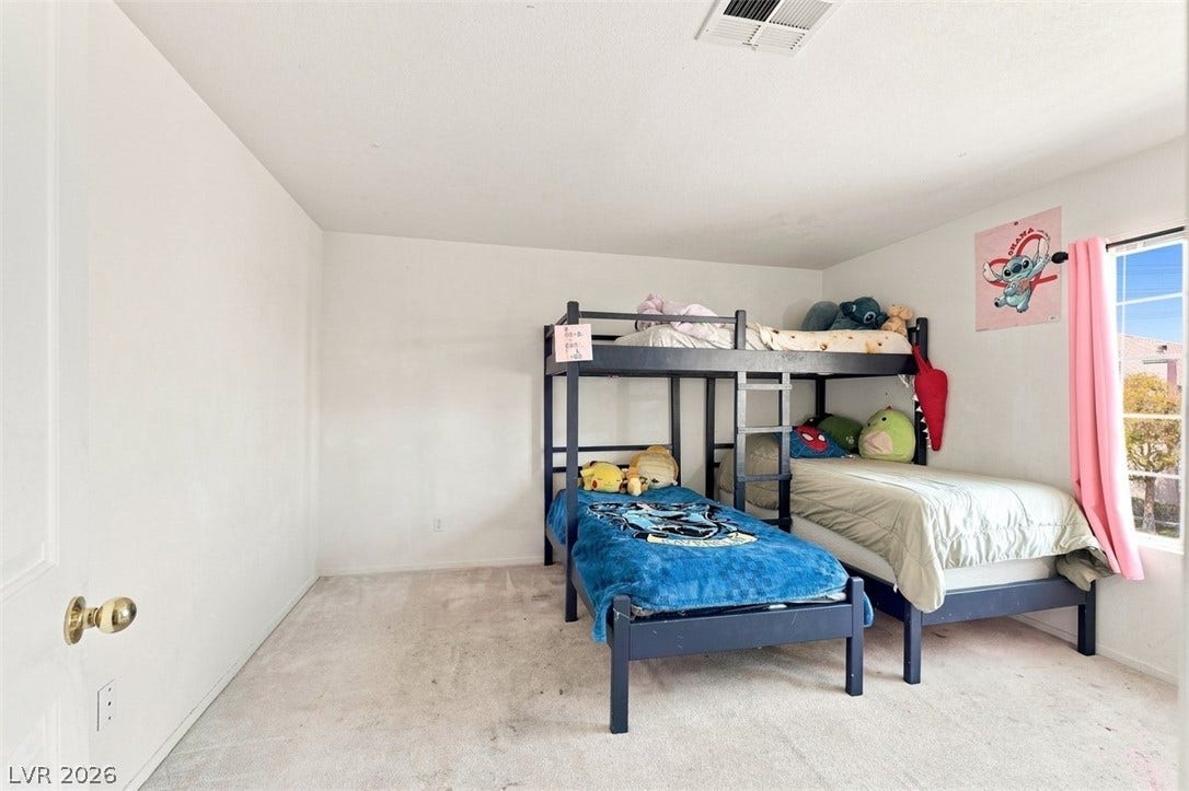 505 Rafkin Place, Henderson, NV 89052 A well-lit bedroom provides comfortable accommodations with ample space.