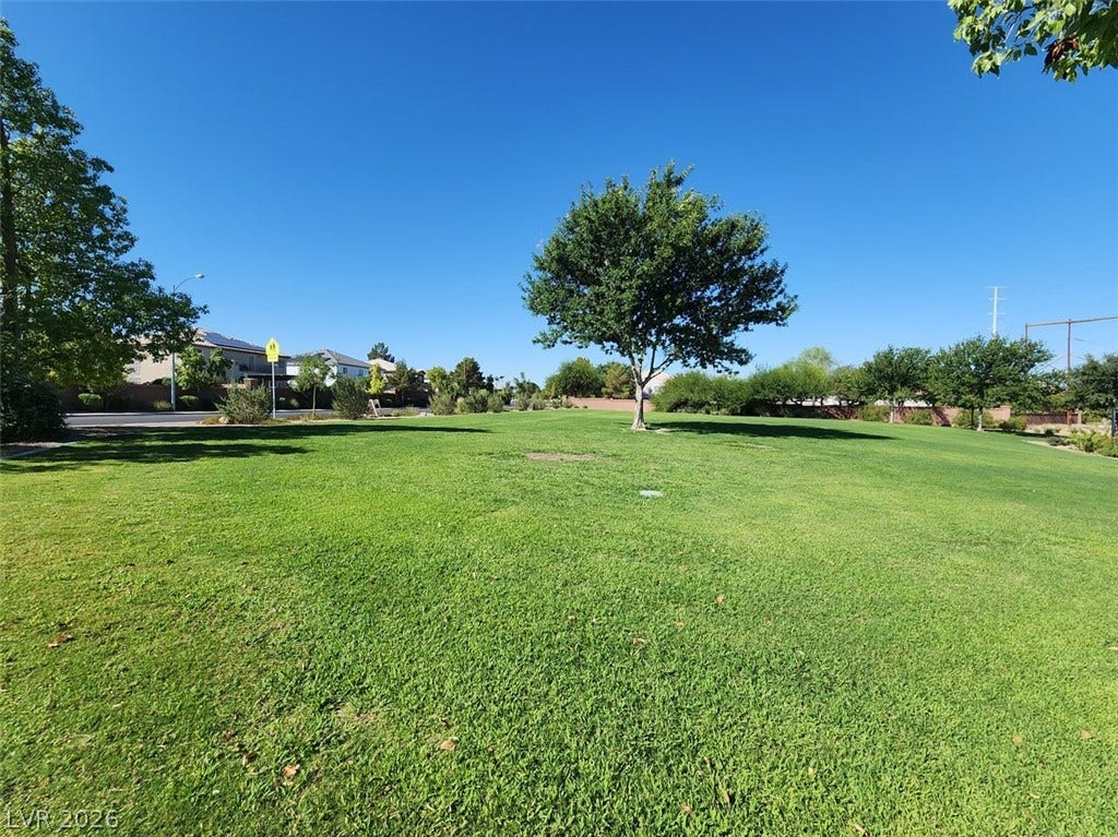 505 Rafkin Place, Henderson, NV 89052 Green open space with a grass and trees provides a serene community park atmosphere.