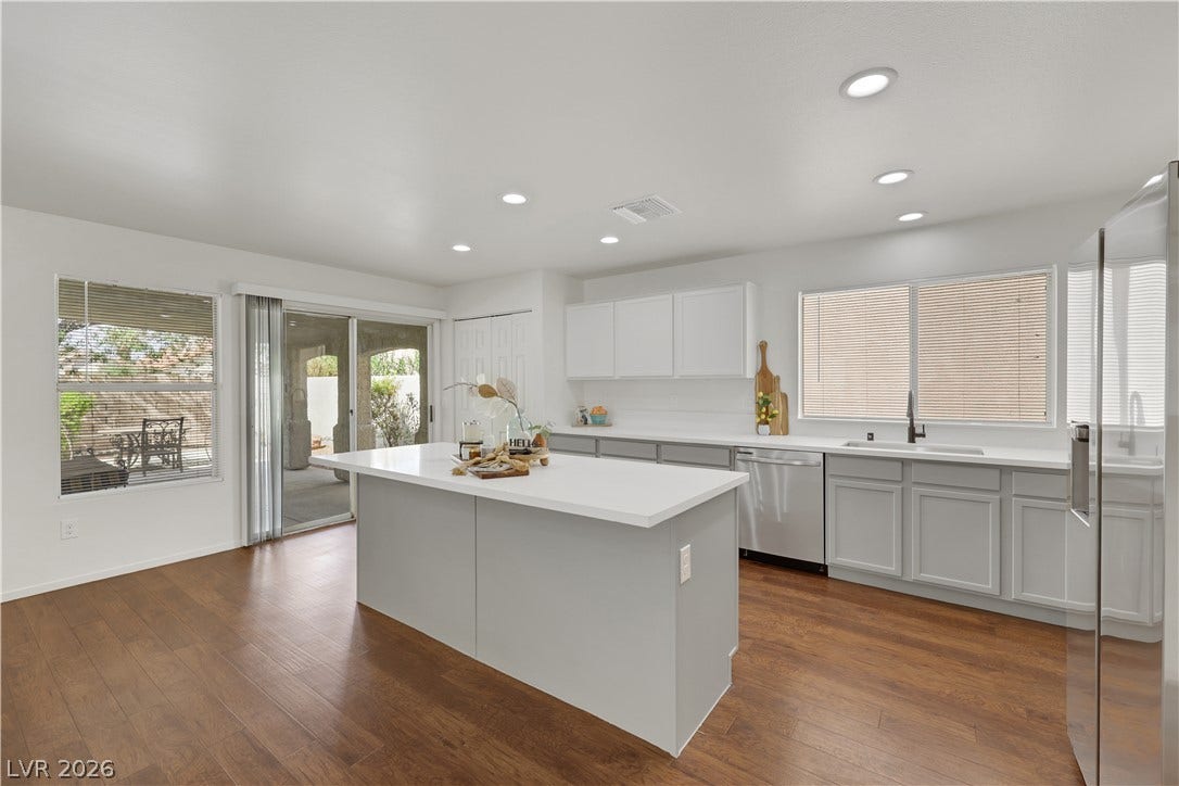 648 Moonlight Mesa Drive, Henderson, NV 89011 A well-lit kitchen features modern appliances and a central island, perfect for culinary endeavors.