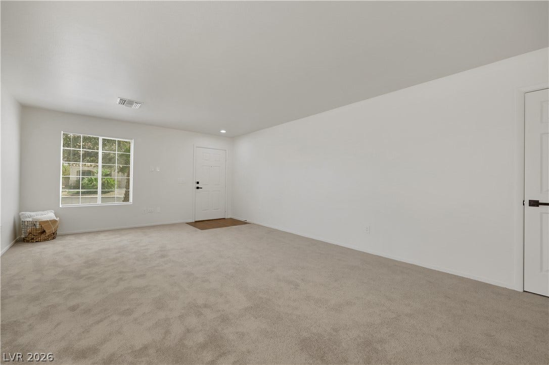 648 Moonlight Mesa Drive, Henderson, NV 89011 A well-lit living area awaits, offering a comfortable space with a welcoming entrance.