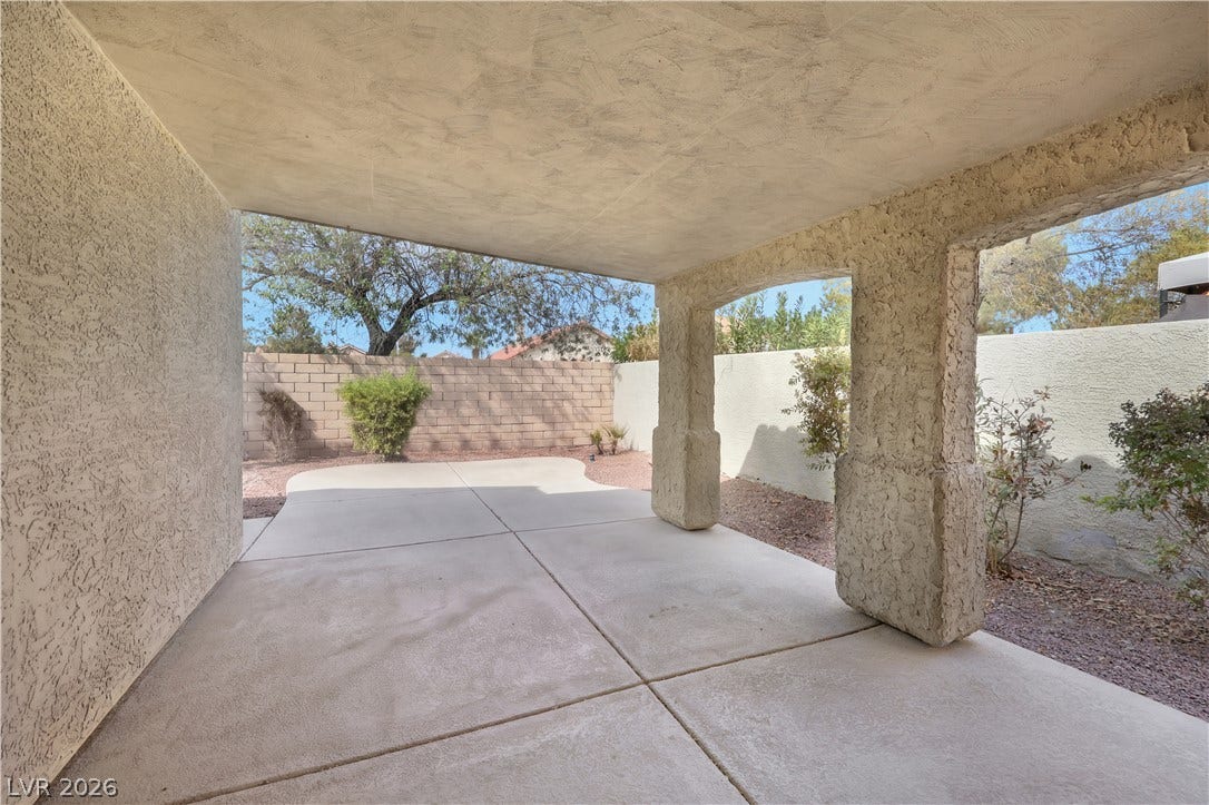 648 Moonlight Mesa Drive, Henderson, NV 89011 A spacious, covered concrete patio awaits, offering a private outdoor retreat.