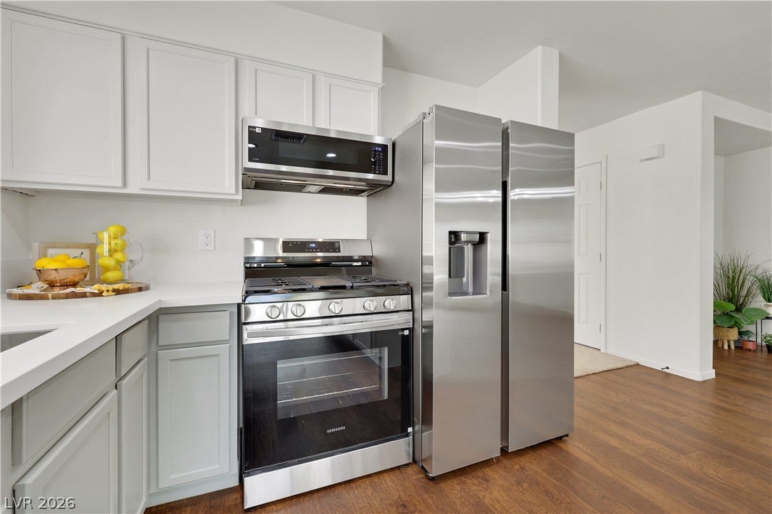 648 Moonlight Mesa Drive, Henderson, NV 89011 A well-appointed kitchen features stainless steel appliances and abundant counter space.