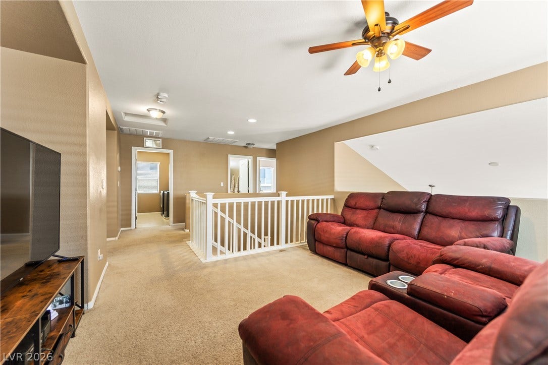 7337 Picnic Hill Street, Las Vegas, NV 89166 A comfortable loft area with an inviting space for relaxation.