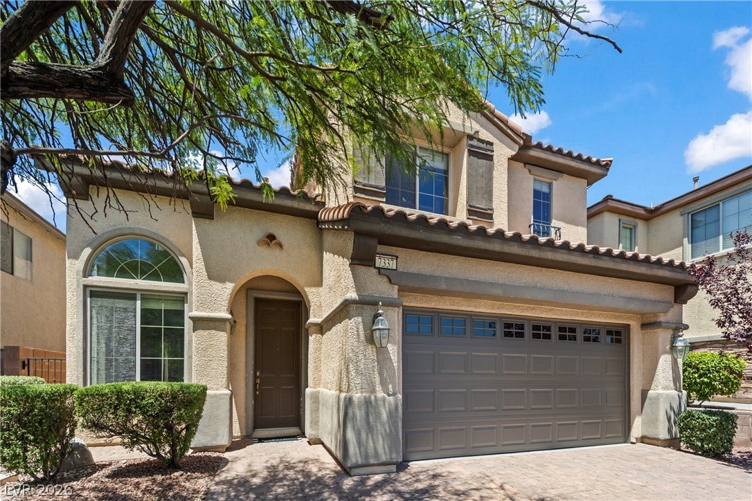 7337 Picnic Hill Street, Las Vegas, NV 89166 A charming exterior with Mediterranean-inspired architecture welcomes you home, boasting a tiled roof and integrated garage.