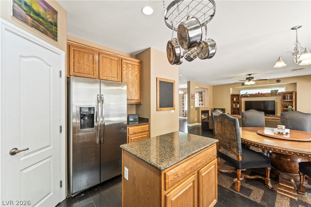 7337 Picnic Hill Street, Las Vegas, NV 89166 An inviting open-concept kitchen flows seamlessly into the dining and living spaces, perfect for entertaining.