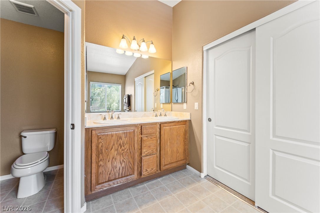 7337 Picnic Hill Street, Las Vegas, NV 89166 Double vanity in this bathroom provides convenience and ample counter space.