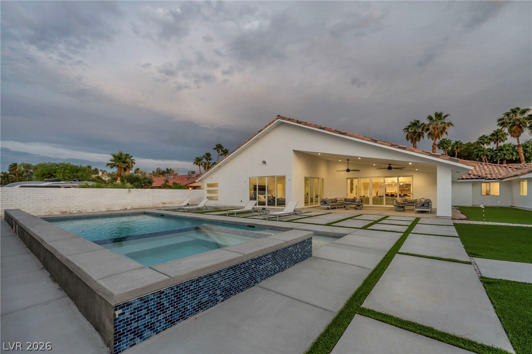 3630 Tobias Lane, Las Vegas, NV 89120 An inviting backyard oasis offers a sparkling in-ground pool, spa, and a spacious covered patio perfect for al fresco living.