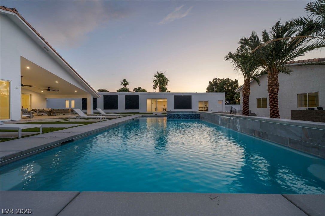 3630 Tobias Lane, Las Vegas, NV 89120 An inviting backyard oasis awaits with a pristine swimming pool and shaded patio.