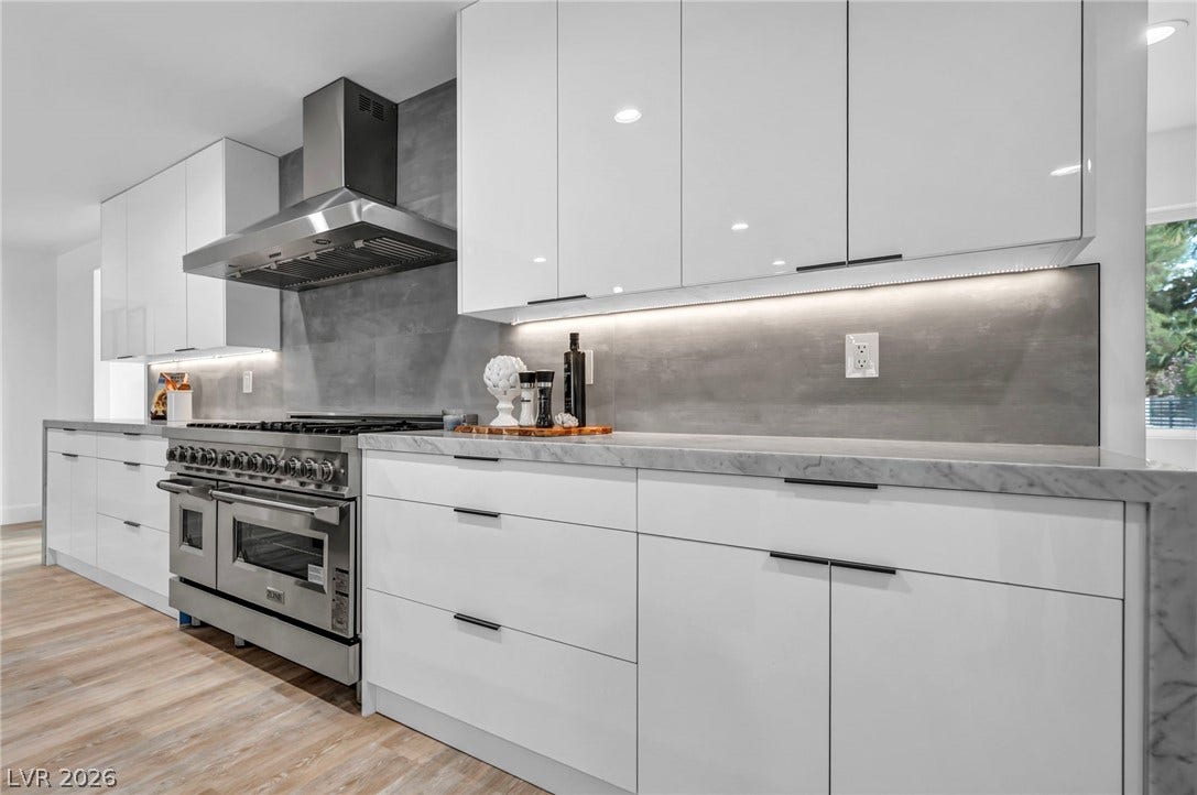 3630 Tobias Lane, Las Vegas, NV 89120 Culinary dreams come alive in this kitchen featuring high-gloss cabinetry and a professional-grade range.