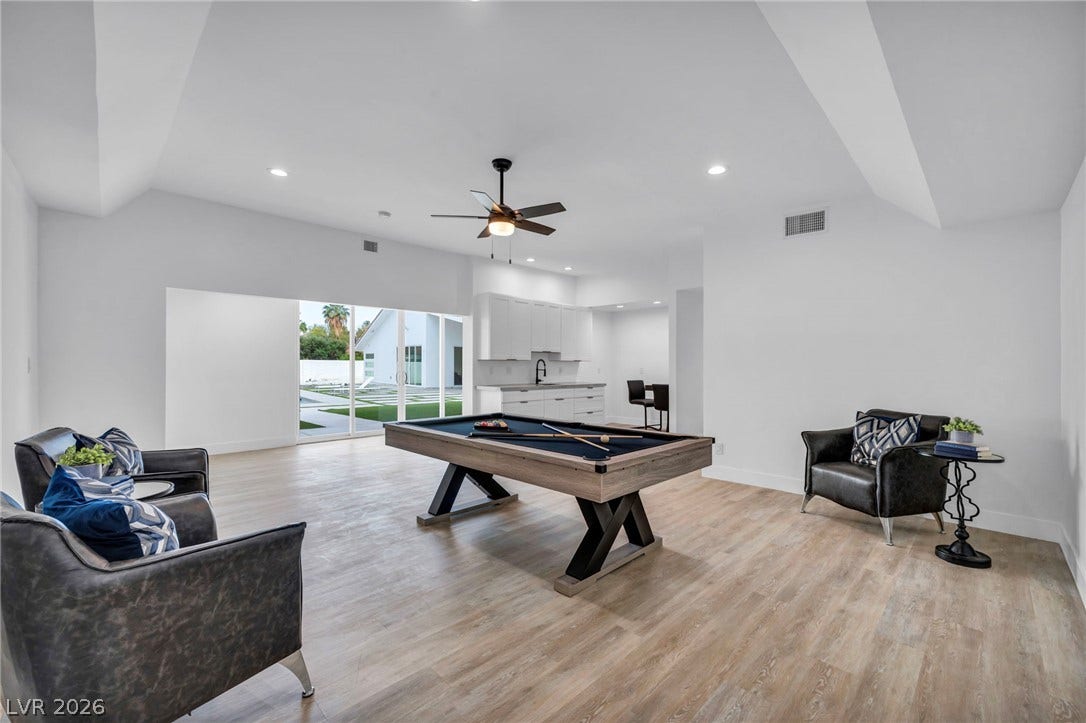 3630 Tobias Lane, Las Vegas, NV 89120 Vast recreation room with soaring vaulted ceilings and expansive glass sliders invites outdoor living.