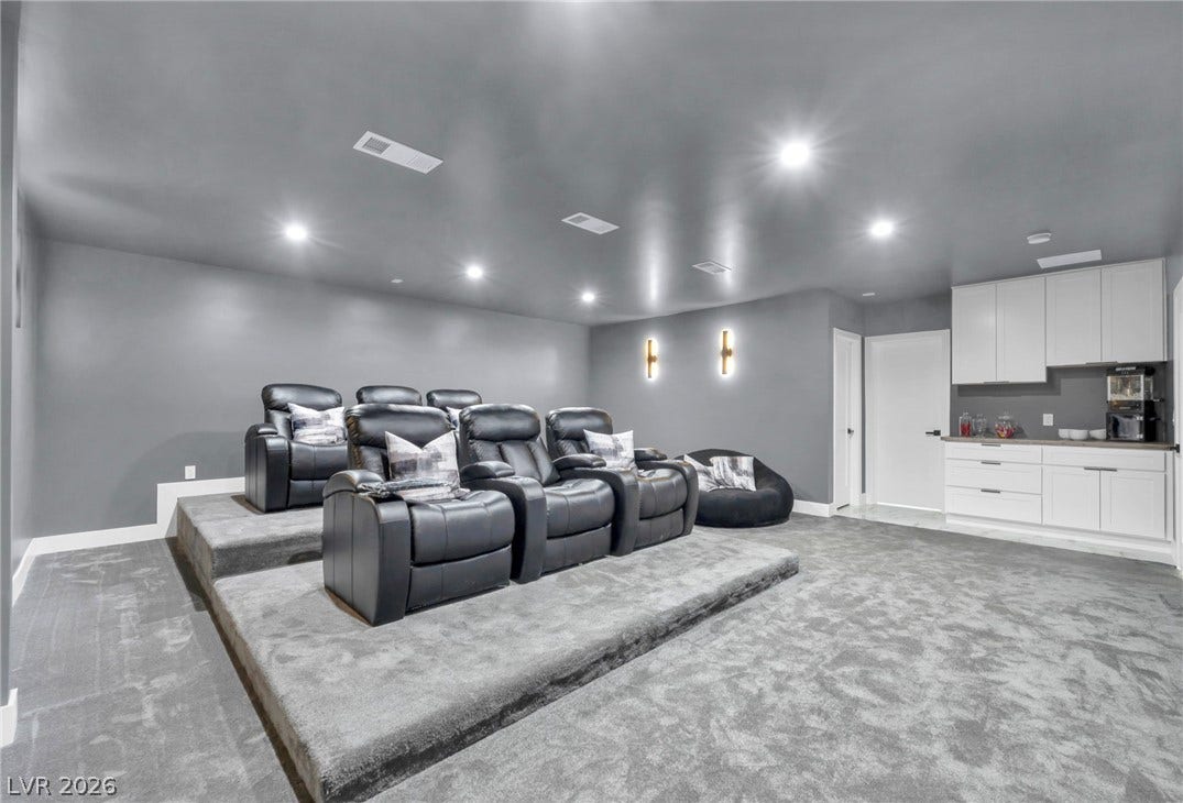 3630 Tobias Lane, Las Vegas, NV 89120 Indulge in cinematic luxury within this dedicated home theater, complete with tiered seating.