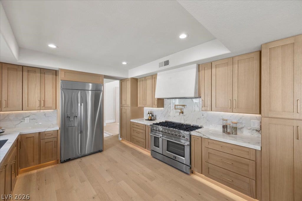 8024 Shorecrest Drive, Las Vegas, NV 89128 Culinary delights await in this bright kitchen with premium appliances and generous cabinet storage.