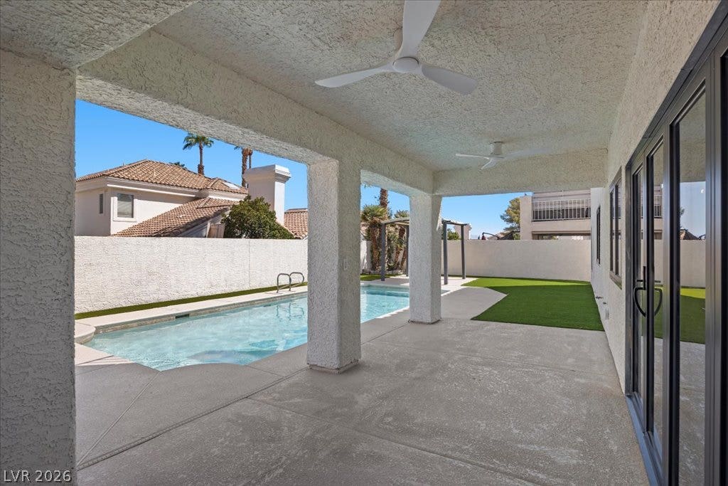 8024 Shorecrest Drive, Las Vegas, NV 89128 Enjoy outdoor living with a private pool, turf area, and covered patio.
