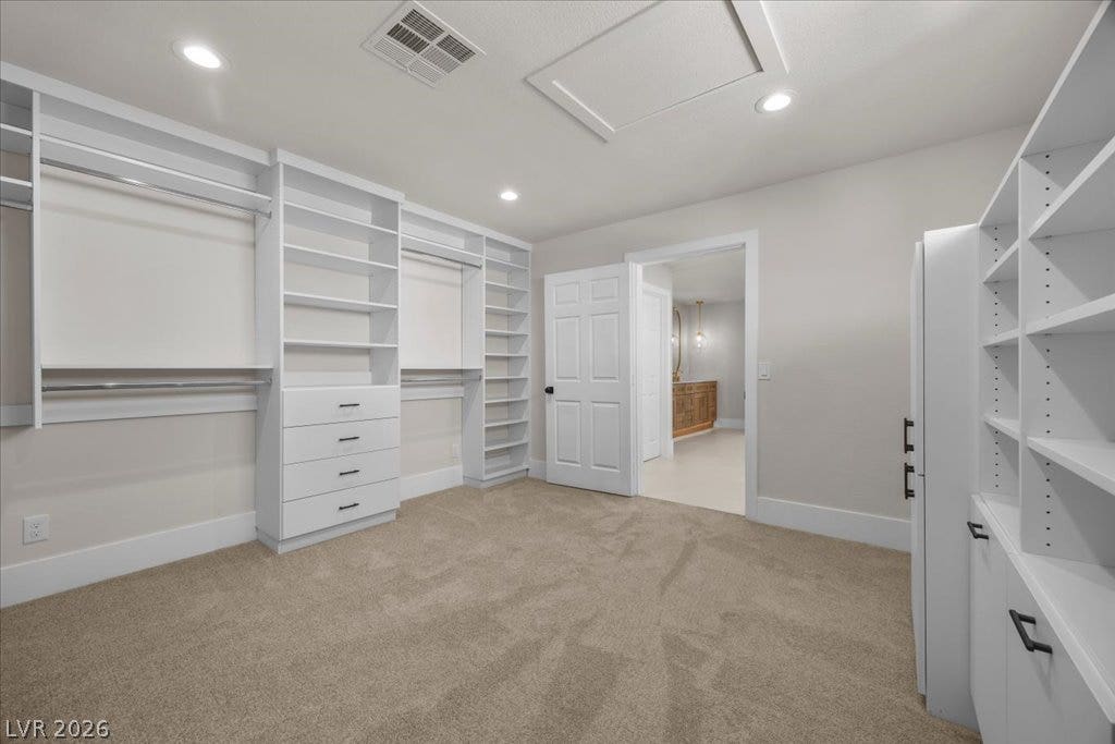 8024 Shorecrest Drive, Las Vegas, NV 89128 Organized closet space with built-in shelving and soft carpeting provides ample storage.