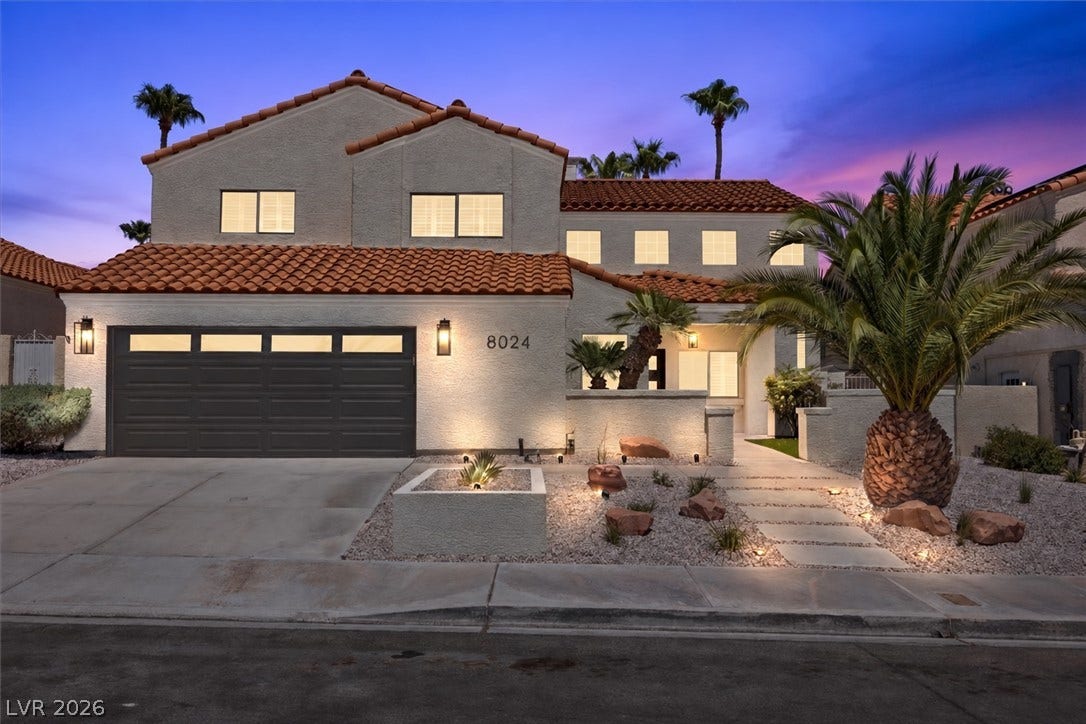 8024 Shorecrest Drive, Las Vegas, NV 89128 Spanish tile roofing and stucco exterior walls create classic Mediterranean architectural character.