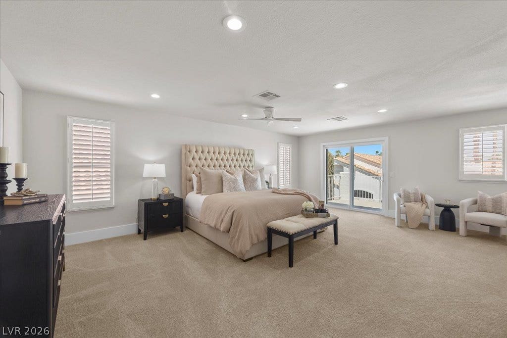 8024 Shorecrest Drive, Las Vegas, NV 89128 The tranquil bedroom offers soft carpeting and a private sliding glass door balcony.