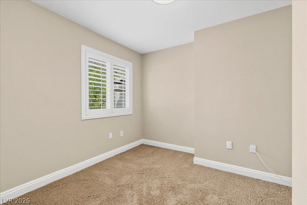 2000 Silverton Drive, Henderson, NV 89074 A quiet, inviting room offers plush carpeting and a bright window with classic plantation shutters.