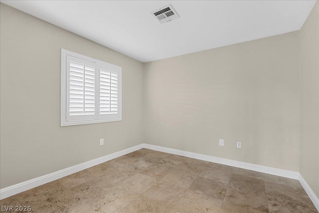 2000 Silverton Drive, Henderson, NV 89074 A well-proportioned room features durable tile flooring and natural light through louvered window treatments.