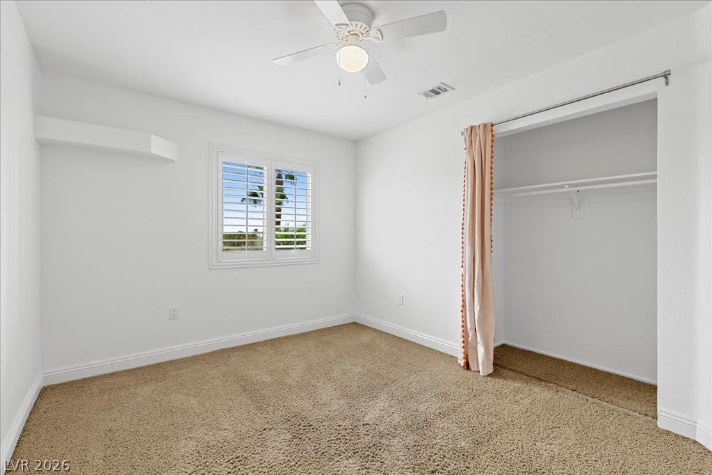 2000 Silverton Drive, Henderson, NV 89074 A quiet bedroom offering comfort and a view through classic plantation shutters.