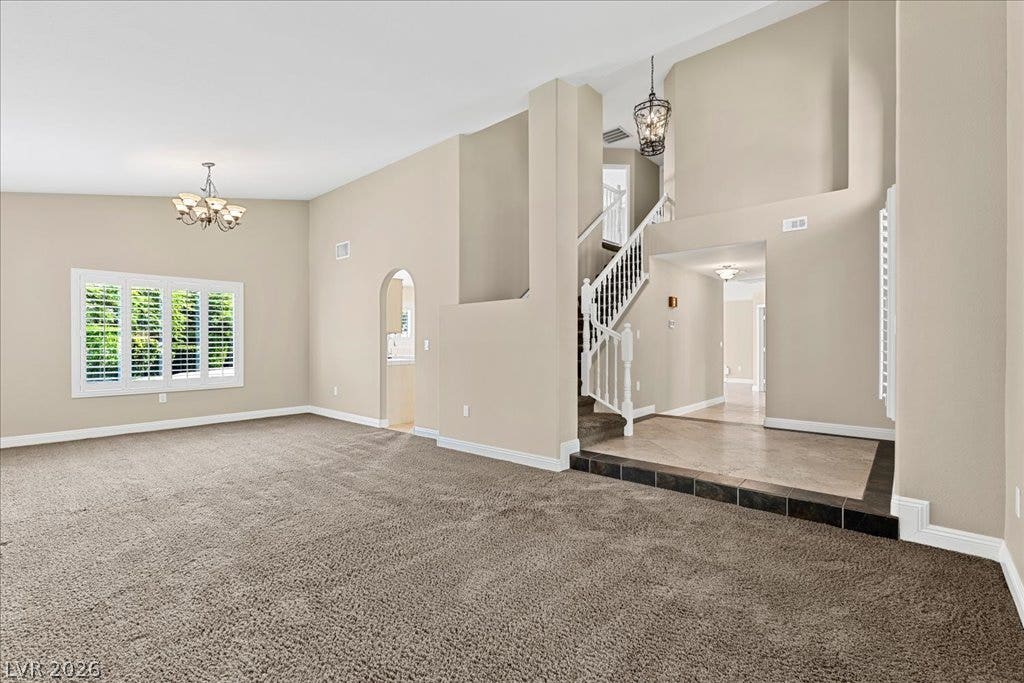 2000 Silverton Drive, Henderson, NV 89074 A grand entrance welcomes guests with soaring ceilings, a striking staircase, and an elegant chandelier.
