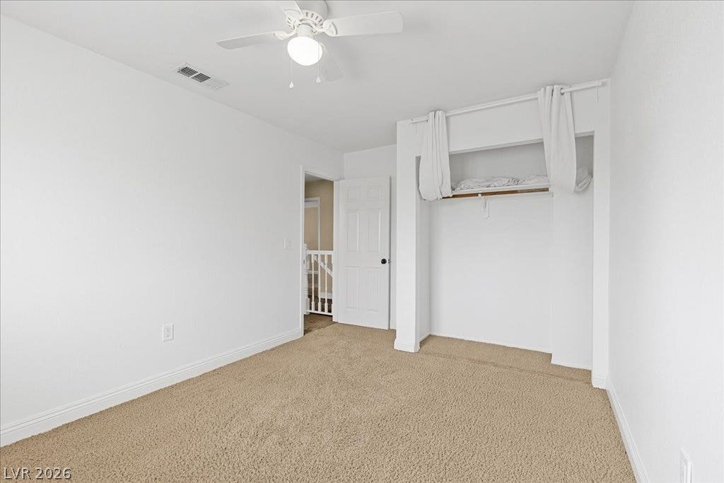 2000 Silverton Drive, Henderson, NV 89074 A quiet bedroom with plush carpet and a convenient open closet awaits your personal touch.