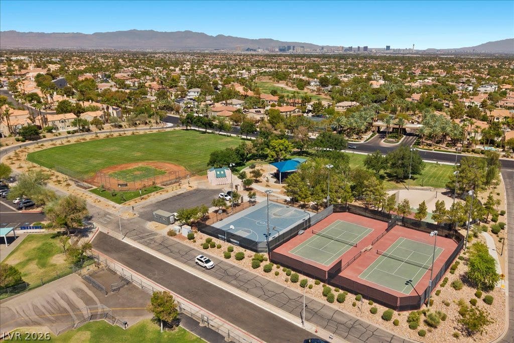 2000 Silverton Drive, Henderson, NV 89074 An aerial perspective reveals a vibrant community park with extensive recreational facilities nestled within a residential landscape.