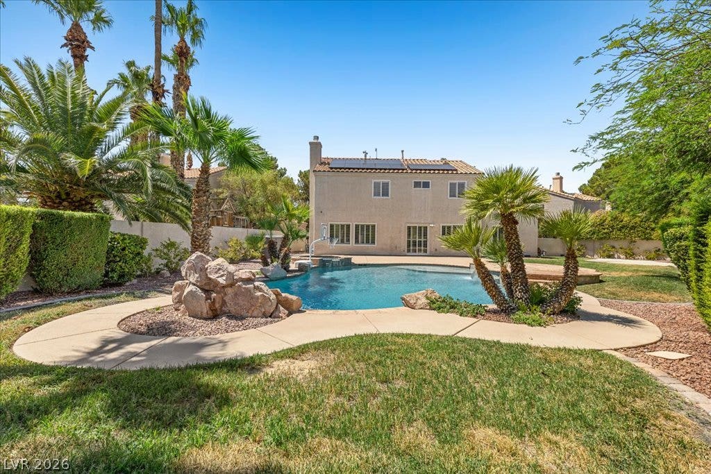 2000 Silverton Drive, Henderson, NV 89074 An inviting backyard oasis offers a sparkling pool and lush landscaping.