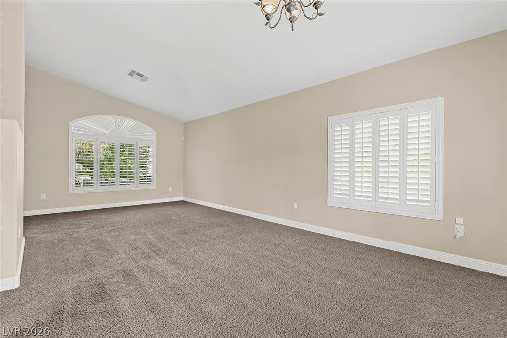2000 Silverton Drive, Henderson, NV 89074 A well-lit living area features neutral tones and elegant plantation shutters.