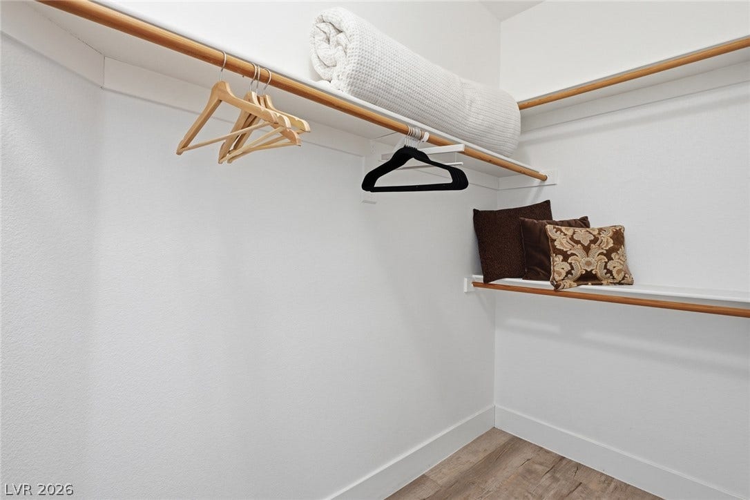 9615 Sedona Hills Court, Las Vegas, NV 89147 Functional closet space offers ample storage with hanging rods and convenient shelving.