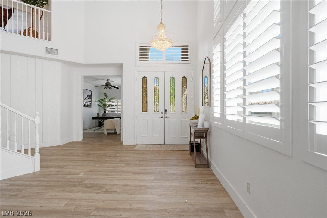 9615 Sedona Hills Court, Las Vegas, NV 89147 A grand entrance welcomes with high ceilings and light-hued flooring.