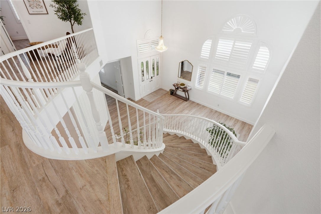 9615 Sedona Hills Court, Las Vegas, NV 89147 Grand curved staircase and a brightly lit foyer with soaring ceilings welcome you into this graceful home.