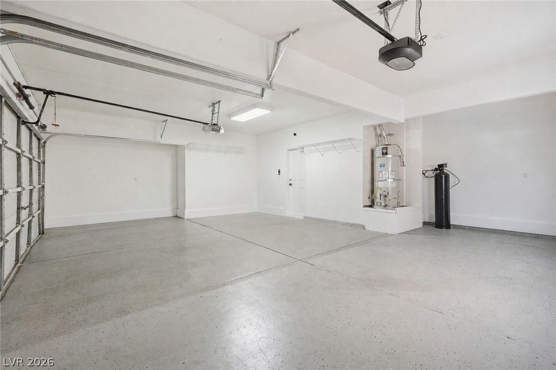 9615 Sedona Hills Court, Las Vegas, NV 89147 A spacious, freshly painted garage offers ample room for vehicles and storage.