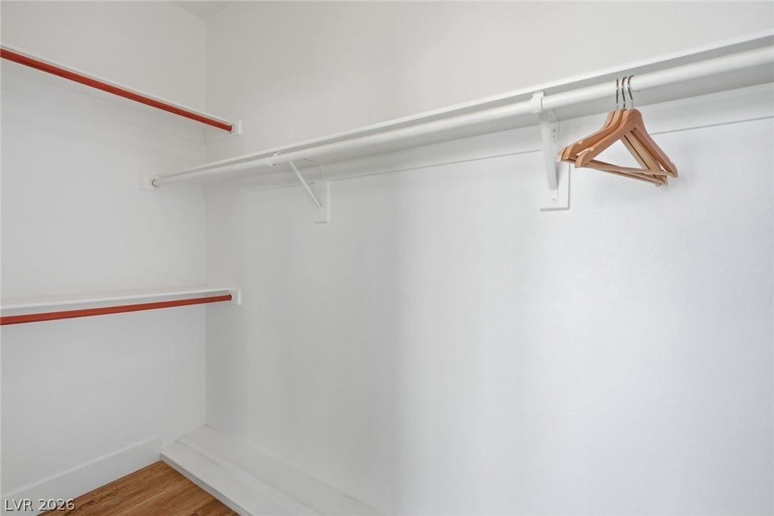 9615 Sedona Hills Court, Las Vegas, NV 89147 Functional closet with ample storage solutions, featuring shelves and a sturdy hanging rod for organized living.