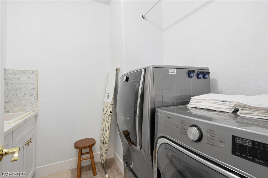 9615 Sedona Hills Court, Las Vegas, NV 89147 A well-appointed utility room includes modern washer and dryer units for effortless household tasks.