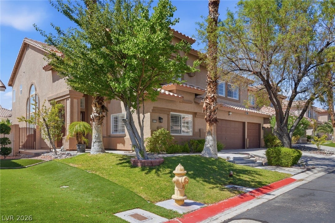 9615 Sedona Hills Court, Las Vegas, NV 89147 A well-maintained suburban residence offers inviting curb appeal and a two-car garage.