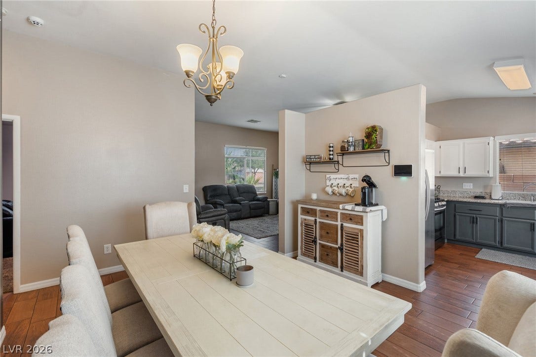 Hardwood floors flow through this welcoming dining area, seamlessly connecting to the kitchen and living room.