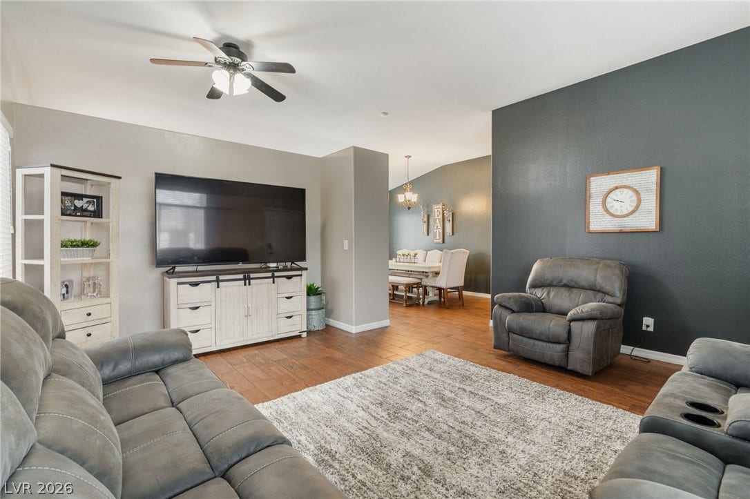 An inviting open-concept living area flows seamlessly into a dedicated dining space.